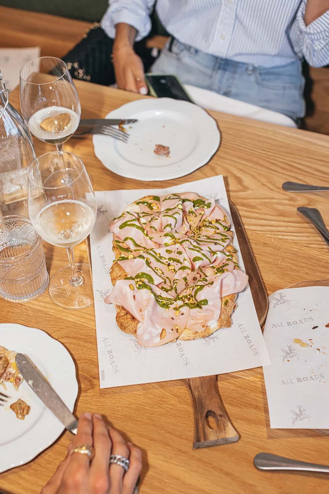 MORTADELLA PINSA recipe served on a plate, by ALL ROADS Pinseria + Enoteca MORTADELLA PINSA recipe served on a plate, by ALL ROADS Pinseria + Enoteca