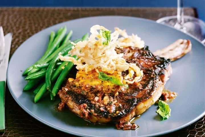 21 Day Dry Aged Bone-In Rib Eye recipe served on a plate, by The Courtney Room 21 Day Dry Aged Bone-In Rib Eye recipe served on a plate, by The Courtney Room