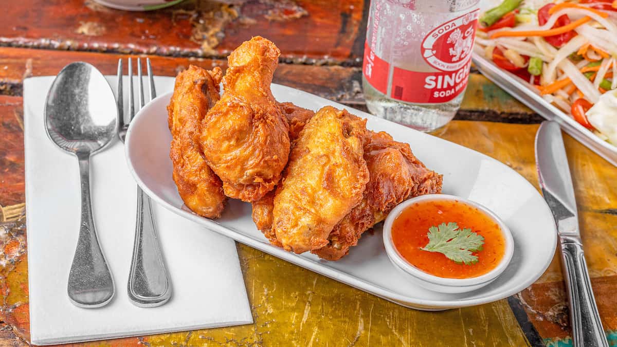 Chicken Wings recipe served on a plate, by Lung Yai Thai Tapas Chicken Wings recipe served on a plate, by Lung Yai Thai Tapas
