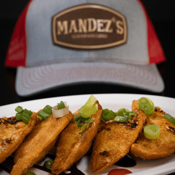 Duck Wontons recipe served on a plate, by Mandez's Seafood Bar & Grill Duck Wontons recipe served on a plate, by Mandez's Seafood Bar & Grill