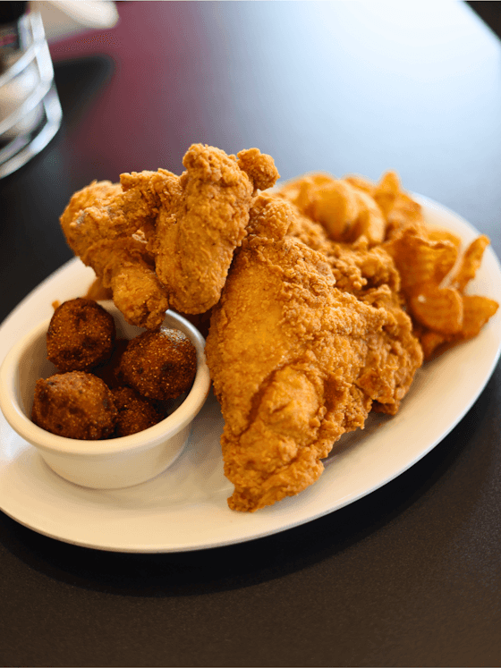 Mandez's Fried Chicken recipe served on a plate, by Mandez's Seafood Bar & Grill Mandez's Fried Chicken recipe served on a plate, by Mandez's Seafood Bar & Grill
