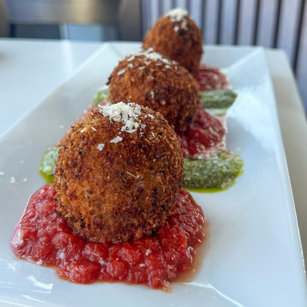 Arancini recipe served on a plate, by Bella Ciao Arancini recipe served on a plate, by Bella Ciao