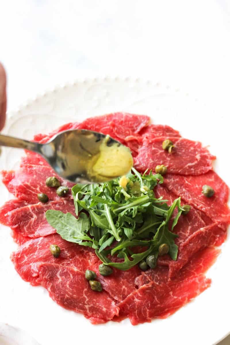 GF Bison Carpaccio recipe served on a plate, by Finns Victoria GF Bison Carpaccio recipe served on a plate, by Finns Victoria