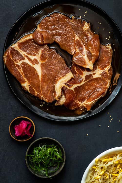 Marinated Pork Collar recipe served on a plate, by Baekjeong Temple City Marinated Pork Collar recipe served on a plate, by Baekjeong Temple City